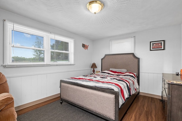 524.526 Rudy Rd, Mansfield, OH 44903 - bedroom with a wainscoted wall and dark wood-type flooring