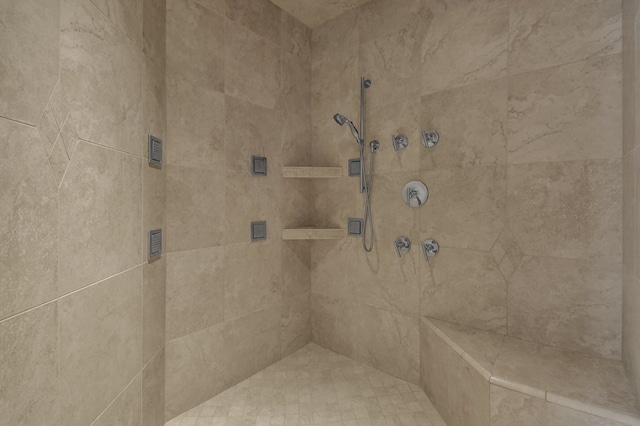 bathroom featuring tiled shower