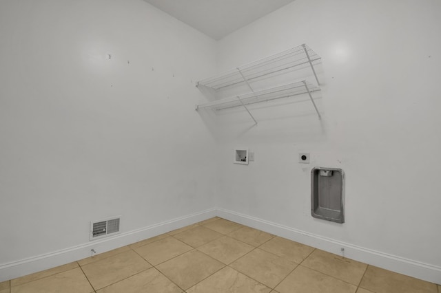 laundry room featuring washer hookup, hookup for an electric dryer, and light tile patterned floors