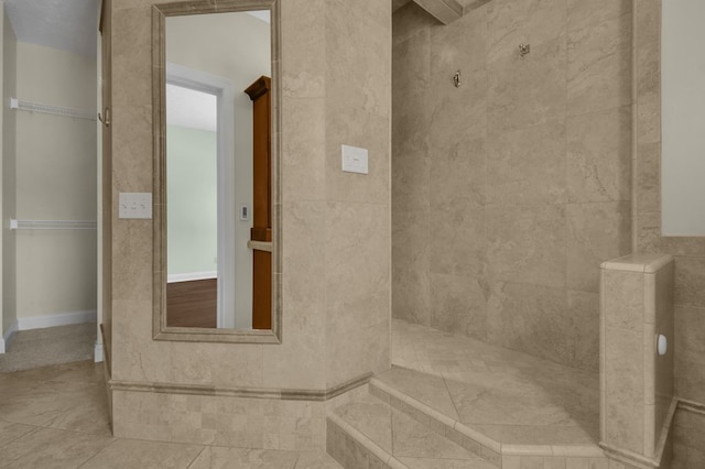 bathroom with tile patterned floors and walk in shower