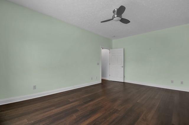 spare room with ceiling fan, dark hardwood / wood-style flooring, and a textured ceiling