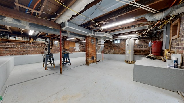 531 Jackson Rd, Galion, OH 44833 - unfinished below grade area featuring electric water heater, electric panel, and brick wall