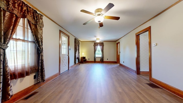 531 Jackson Rd, Galion, OH 44833 - unfurnished room featuring ornamental molding, wood finished floors, ceiling fan, and baseboards