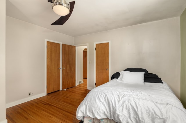 501 Clifton Blvd, Mansfield, OH 44907 - bedroom with wood finished floors, baseboards, arched walkways, and a ceiling fan