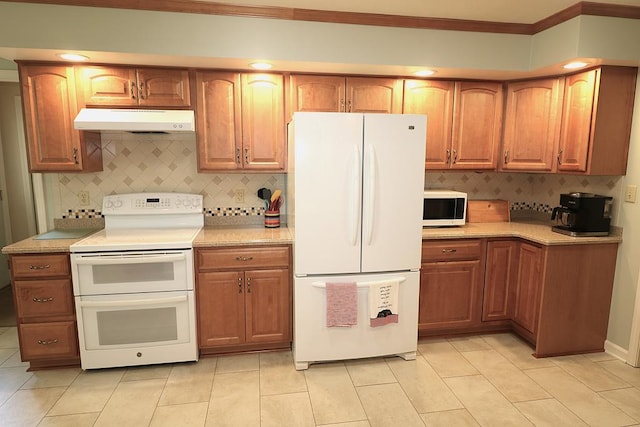 10411 River Rd, Huron, OH 44839 - kitchen featuring white appliances, under cabinet range hood, crown molding, backsplash, and light countertops