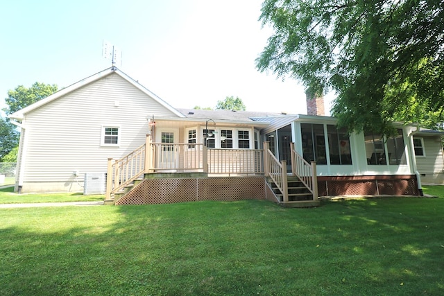 10411 River Rd, Huron, OH 44839 - back of house featuring stairs, a sunroom, a chimney, and a lawn