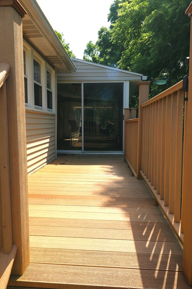 10411 River Rd, Huron, OH 44839 - wooden deck with a sunroom