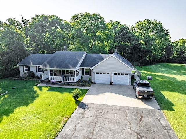 10411 River Rd, Huron, OH 44839 - ranch-style home featuring a porch, a garage, driveway, and a front lawn