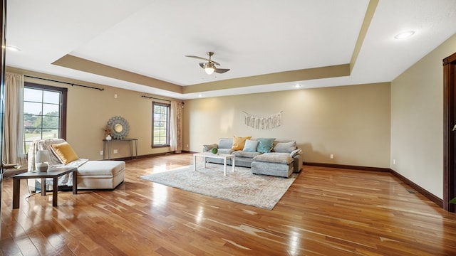 1439 Township Rd Unit 1238, Ashland, OH 44805 - living area featuring a tray ceiling, light wood-style floors, baseboards, a ceiling fan, and recessed lighting
