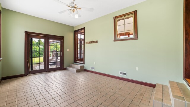 1439 Township Rd Unit 1238, Ashland, OH 44805 - unfurnished room with ceiling fan, baseboards, french doors, and tile patterned flooring