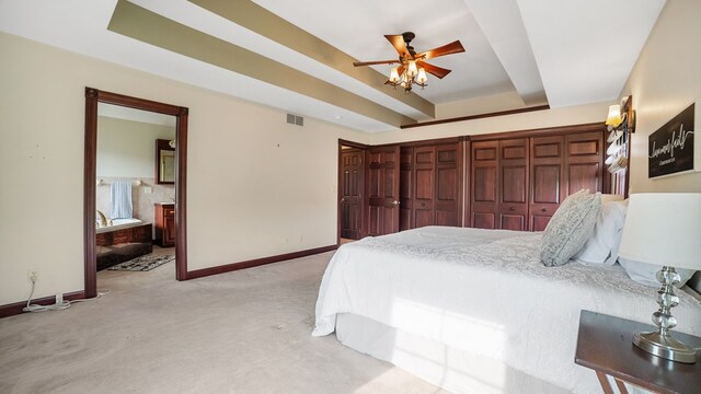 1439 Township Rd Unit 1238, Ashland, OH 44805 - bedroom with baseboards, light colored carpet, a raised ceiling, and ensuite bath