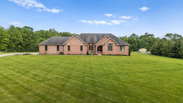 1439 Township Rd Unit 1238, Ashland, OH 44805 - view of front of property featuring brick siding, a front yard, and a shingled roof