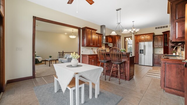1439 Township Rd Unit 1238, Ashland, OH 44805 - dining space with a chandelier, a ceiling fan, and light tile patterned floors