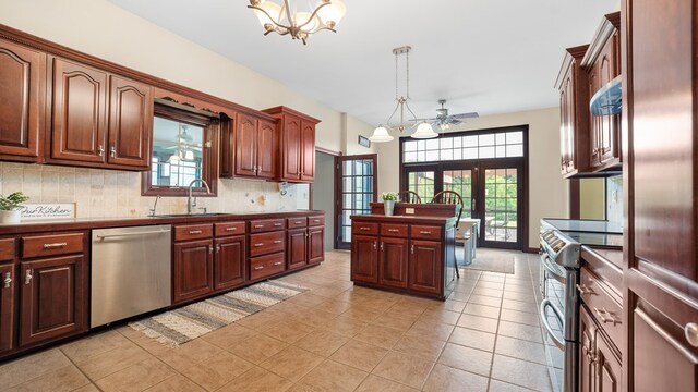 1439 Township Rd Unit 1238, Ashland, OH 44805 - kitchen featuring appliances with stainless steel finishes, a sink, a chandelier, backsplash, and pendant lighting
