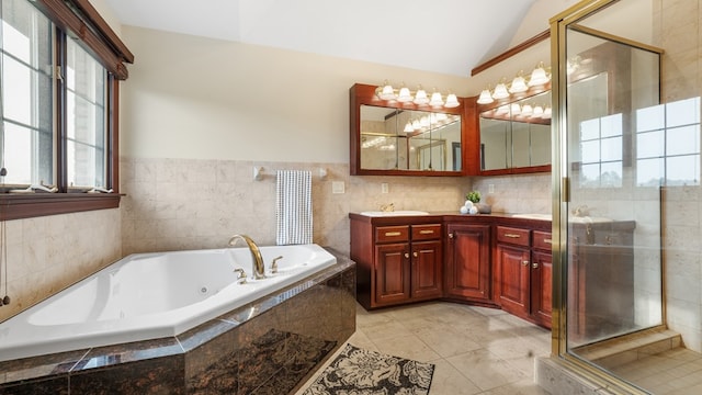 1439 Township Rd Unit 1238, Ashland, OH 44805 - full bath with double vanity, a jetted tub, a stall shower, vaulted ceiling, and tile patterned flooring