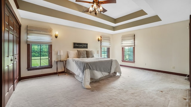 1439 Township Rd Unit 1238, Ashland, OH 44805 - bedroom with light colored carpet, baseboards, a tray ceiling, and ceiling fan