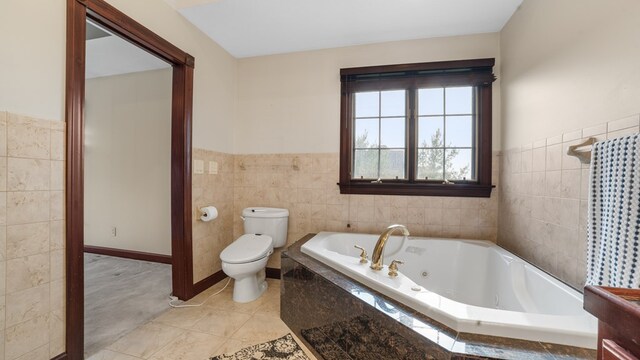 1439 Township Rd Unit 1238, Ashland, OH 44805 - full bath with tile walls, toilet, a whirlpool tub, a wainscoted wall, and tile patterned flooring