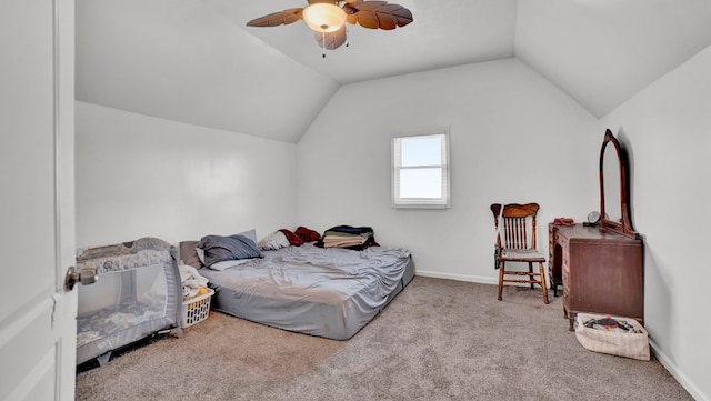 bedroom featuring ceiling fan, light colored carpet, and vaulted ceiling