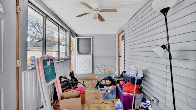 sunroom featuring ceiling fan