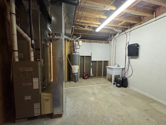 basement featuring sink and water heater