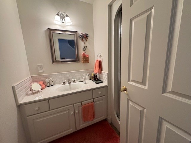 bathroom with vanity and backsplash