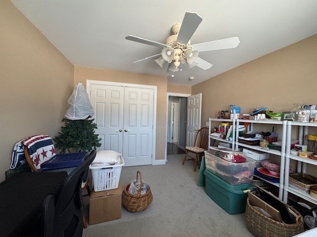 carpeted office featuring ceiling fan