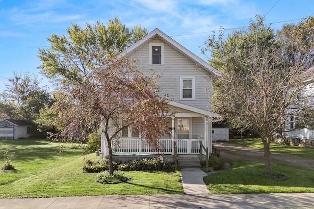 view of front of home with covered porch and a front lawn