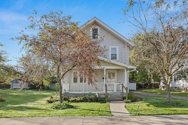 view of front of house with a porch and a front yard