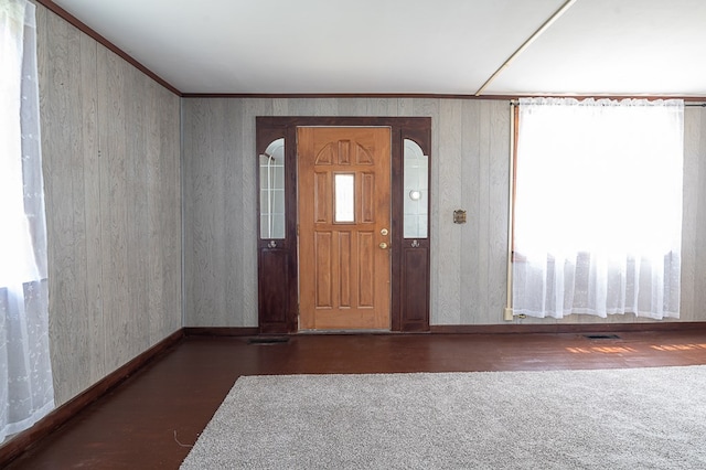 entrance foyer featuring crown molding