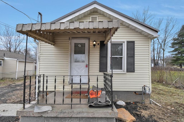 view of front of home featuring fence