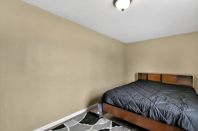 bedroom featuring baseboards