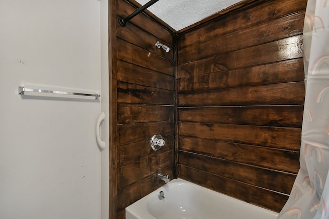 bathroom with shower / bathtub combination with curtain