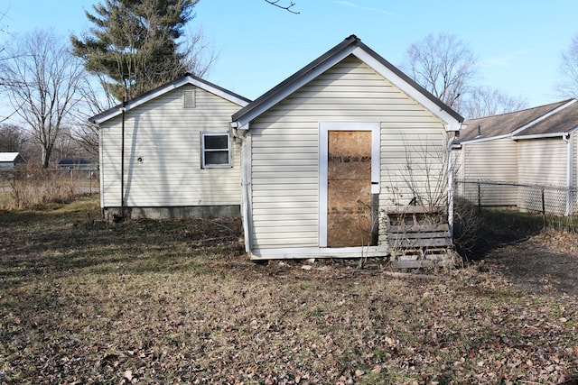 back of property with fence