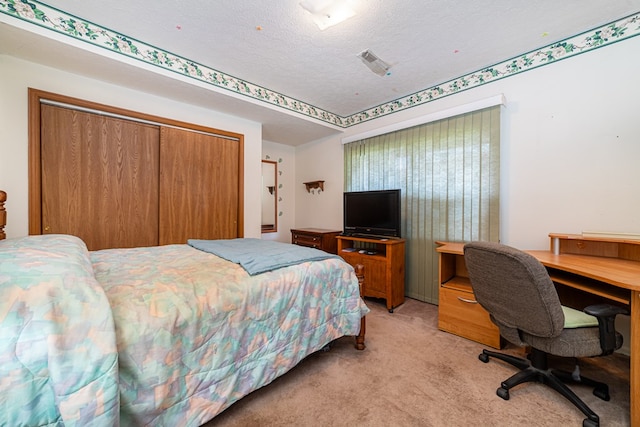 7326 State Route 19 Unit 47-48, Mount Gilead, OH 43338 - bedroom with light colored carpet, a closet, a desk, and a textured ceiling