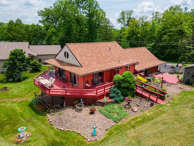 7326 State Route 19 Unit 47-48, Mount Gilead, OH 43338 - back of property with a deck, a lawn, and roof with shingles