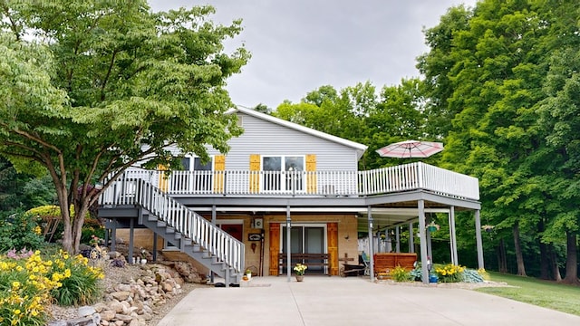 back of house featuring a deck