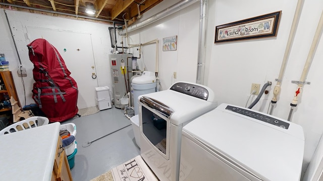 washroom featuring water heater and washer and clothes dryer