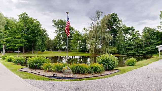 surrounding community featuring a water view