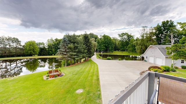 exterior space with a water view and a lawn