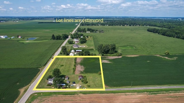 birds eye view of property with a rural view