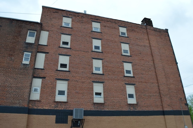 view of building exterior with cooling unit