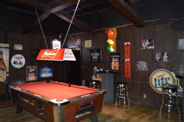 playroom with beam ceiling, wood walls, hardwood / wood-style flooring, and billiards