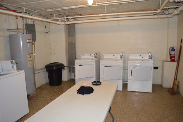 laundry room with water heater and washer and clothes dryer