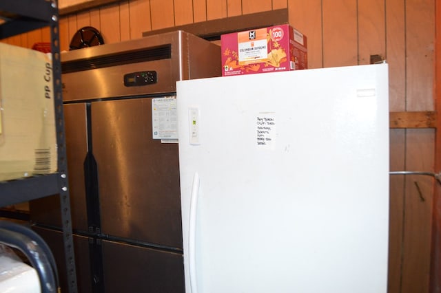 details with white fridge and wooden walls