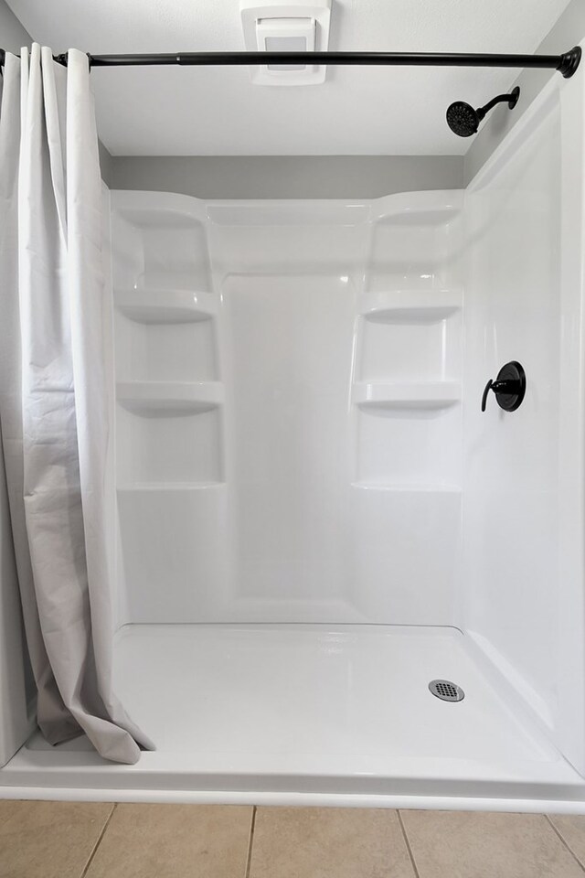 5616 Windfall Rd, Galion, OH 44833 - full bath featuring tile patterned flooring and a stall shower