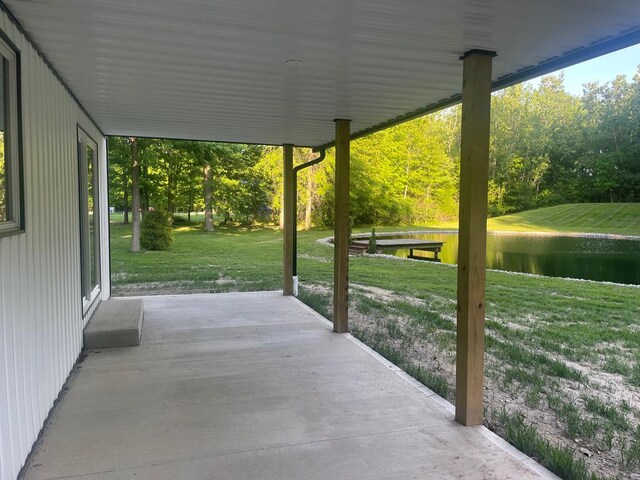5616 Windfall Rd, Galion, OH 44833 - view of patio featuring a water view and view of wooded area