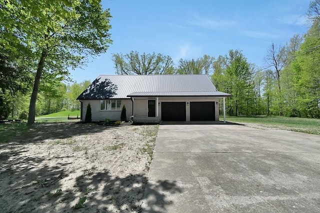 5616 Windfall Rd, Galion, OH 44833 - view of front of property with an attached garage, driveway, and metal roof