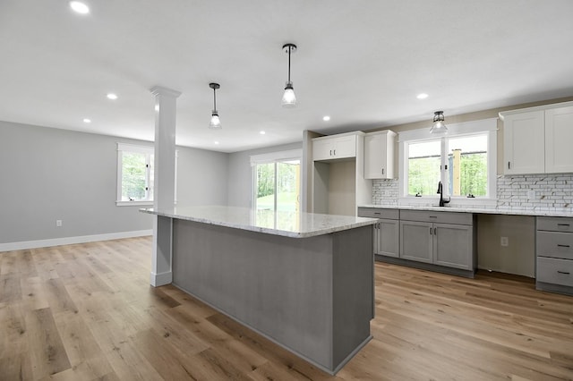 5616 Windfall Rd, Galion, OH 44833 - kitchen featuring gray cabinets, decorative backsplash, healthy amount of natural light, and recessed lighting