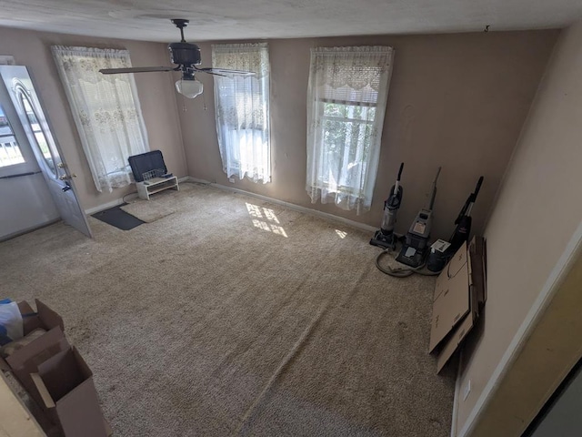 living room with carpet flooring and ceiling fan