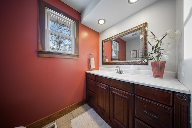 bathroom with tile patterned flooring and vanity